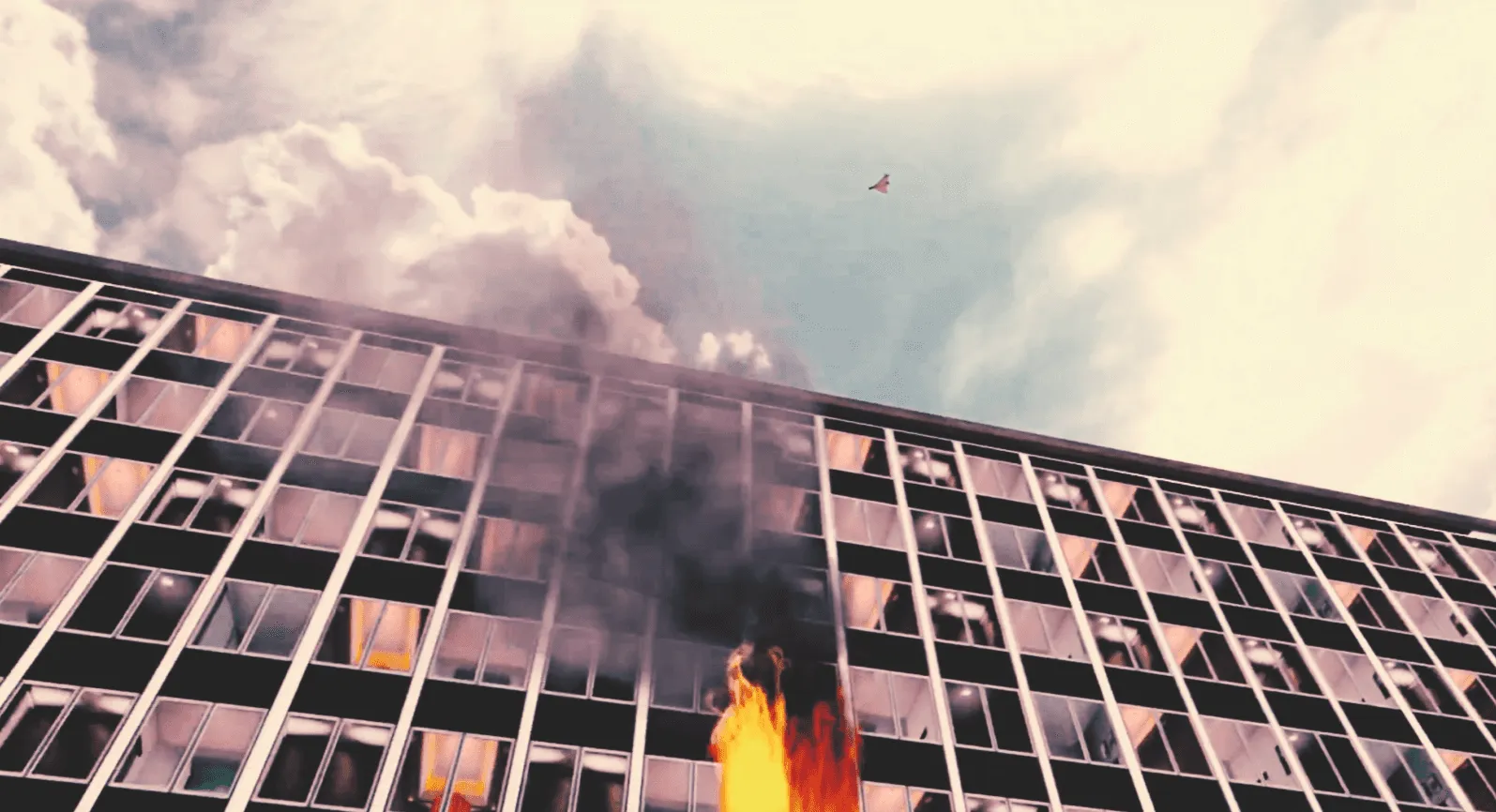 Burning office building seen from the street during the VR air raid.