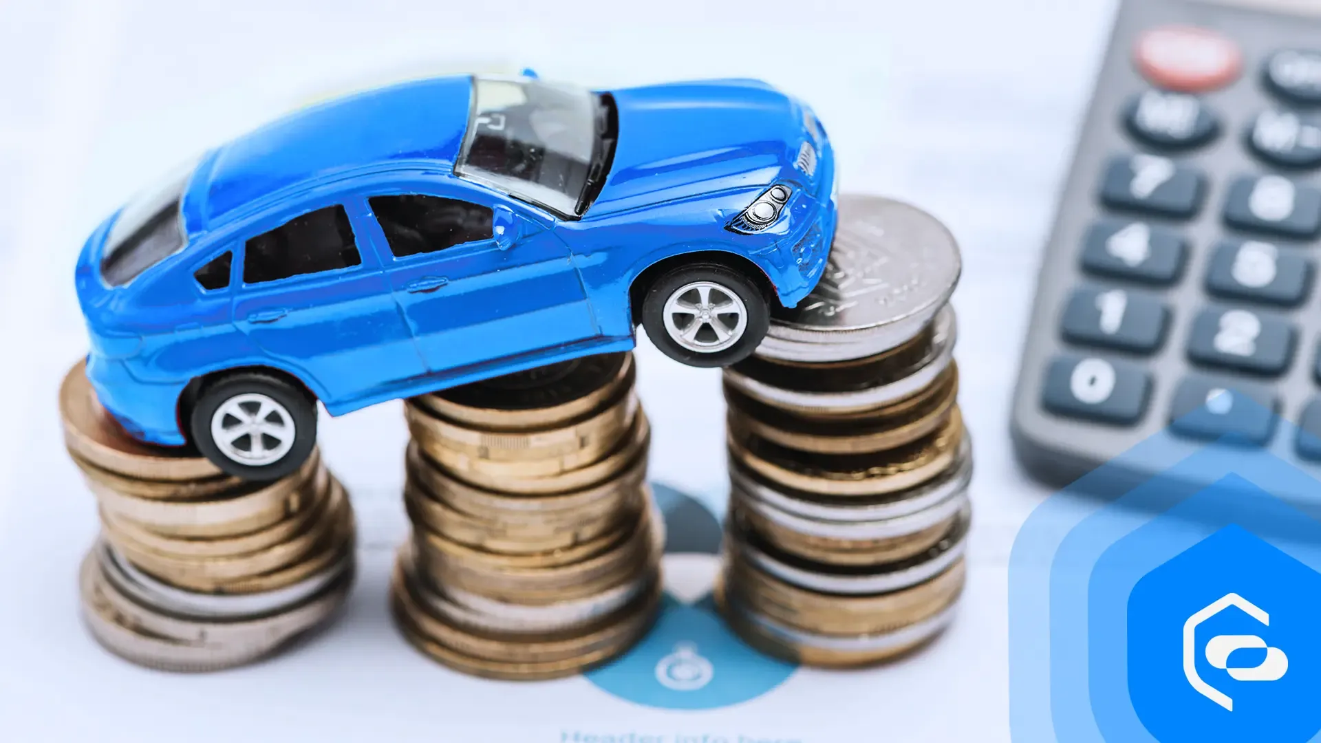A car positioned on a stack of coins