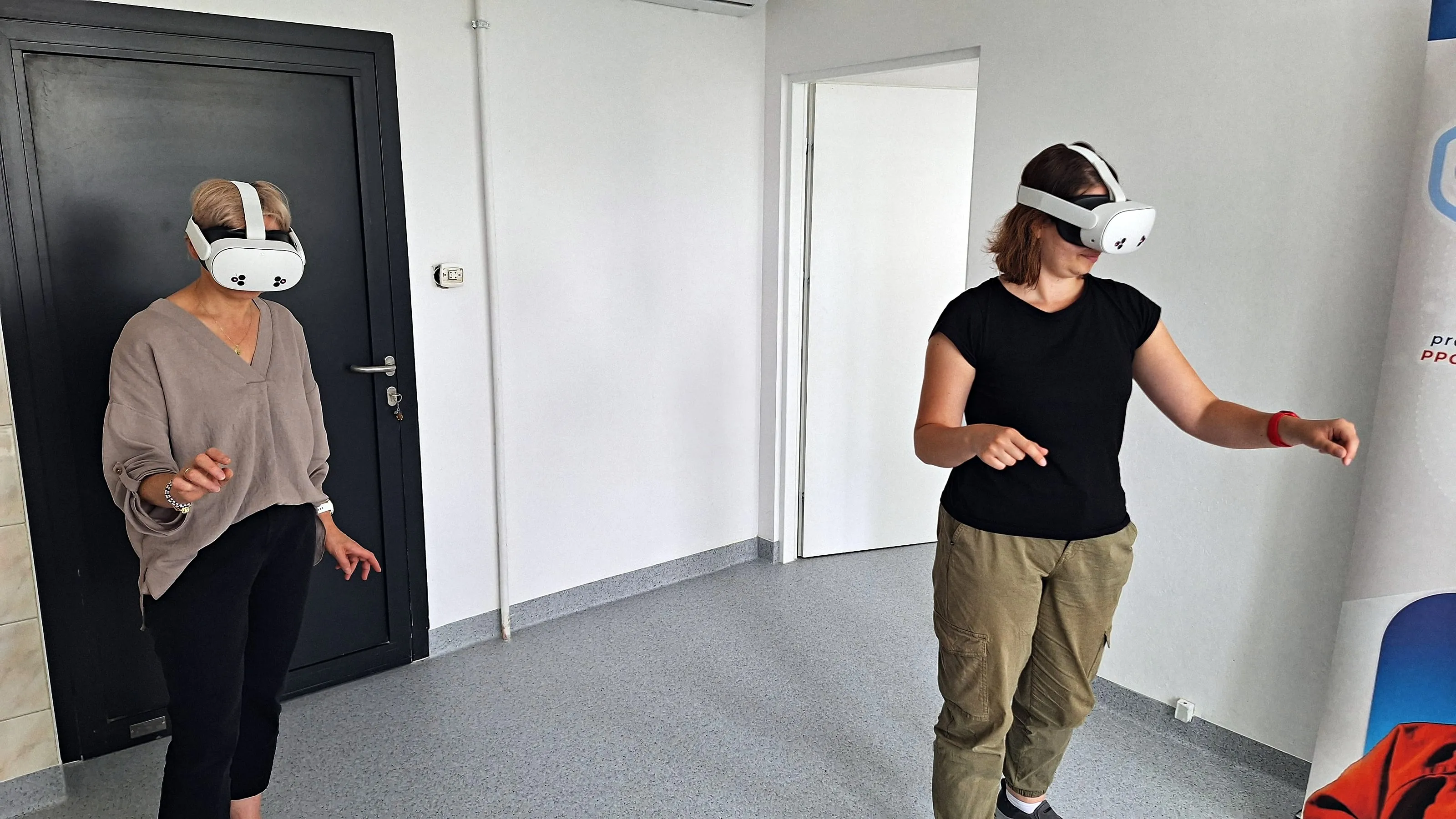 Two people wearing VR headsets during the test of the training at the university