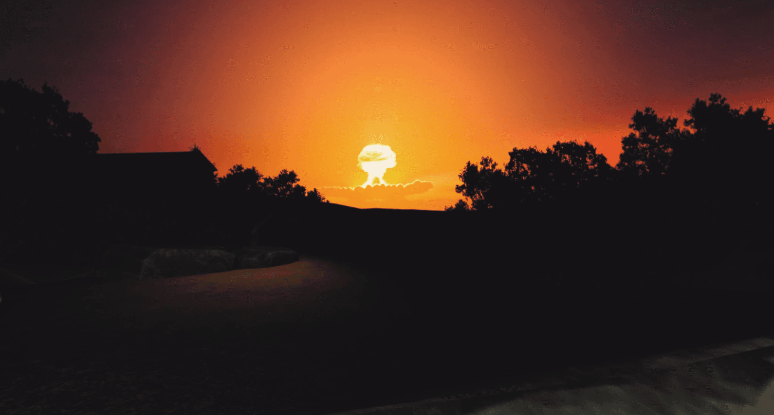 Distant nuclear mushroom cloud at dusk in the NRC threats VR lesson.